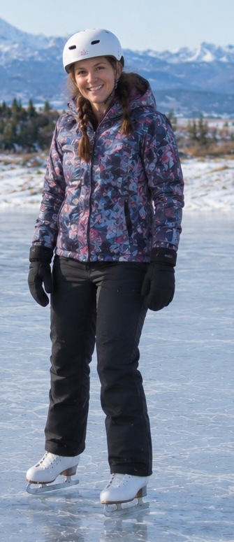 KickStart Skating coach wearing a white helmet and patterned winter jacket